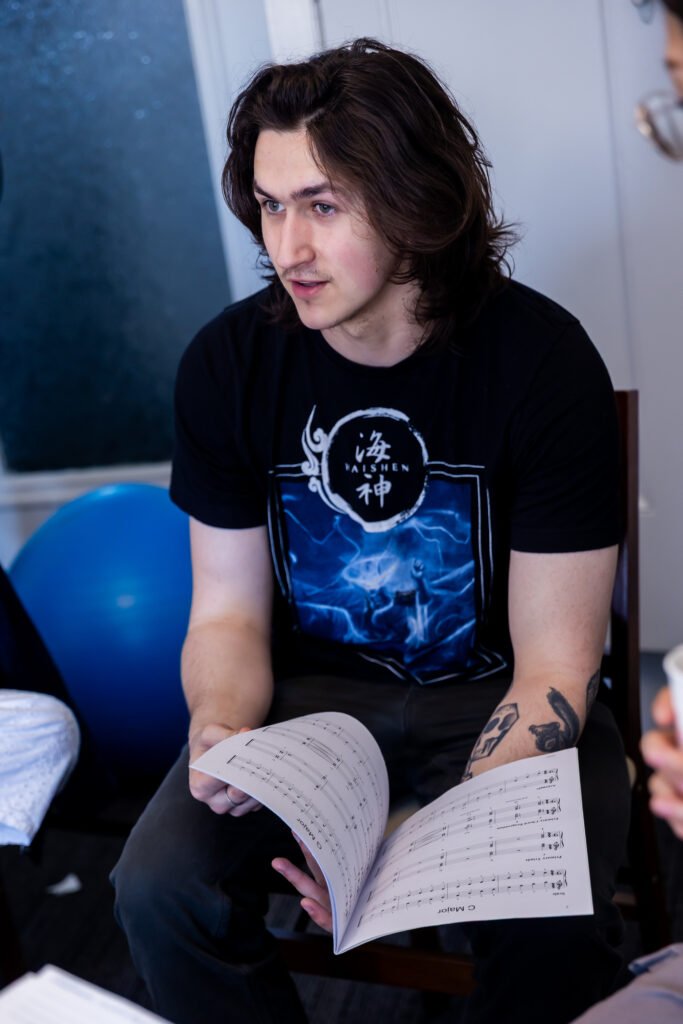 Quinn reading music.